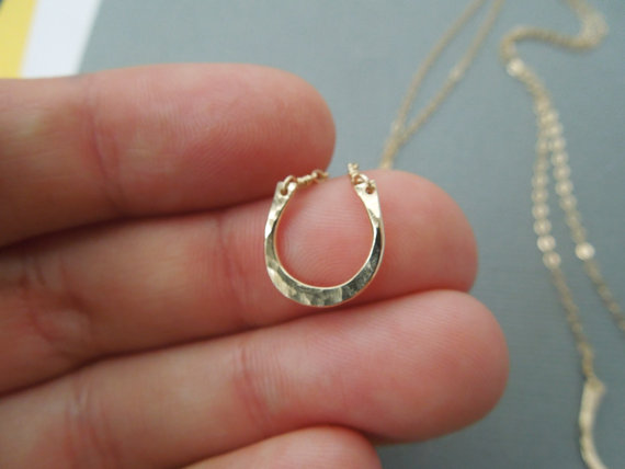Handmade gold horseshoe necklace : One of Fair Ivy's monthly gifts in the mail